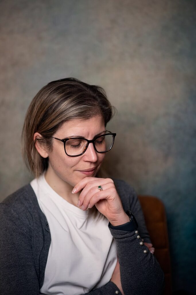 Headshot of lady thinking with her eyes closed