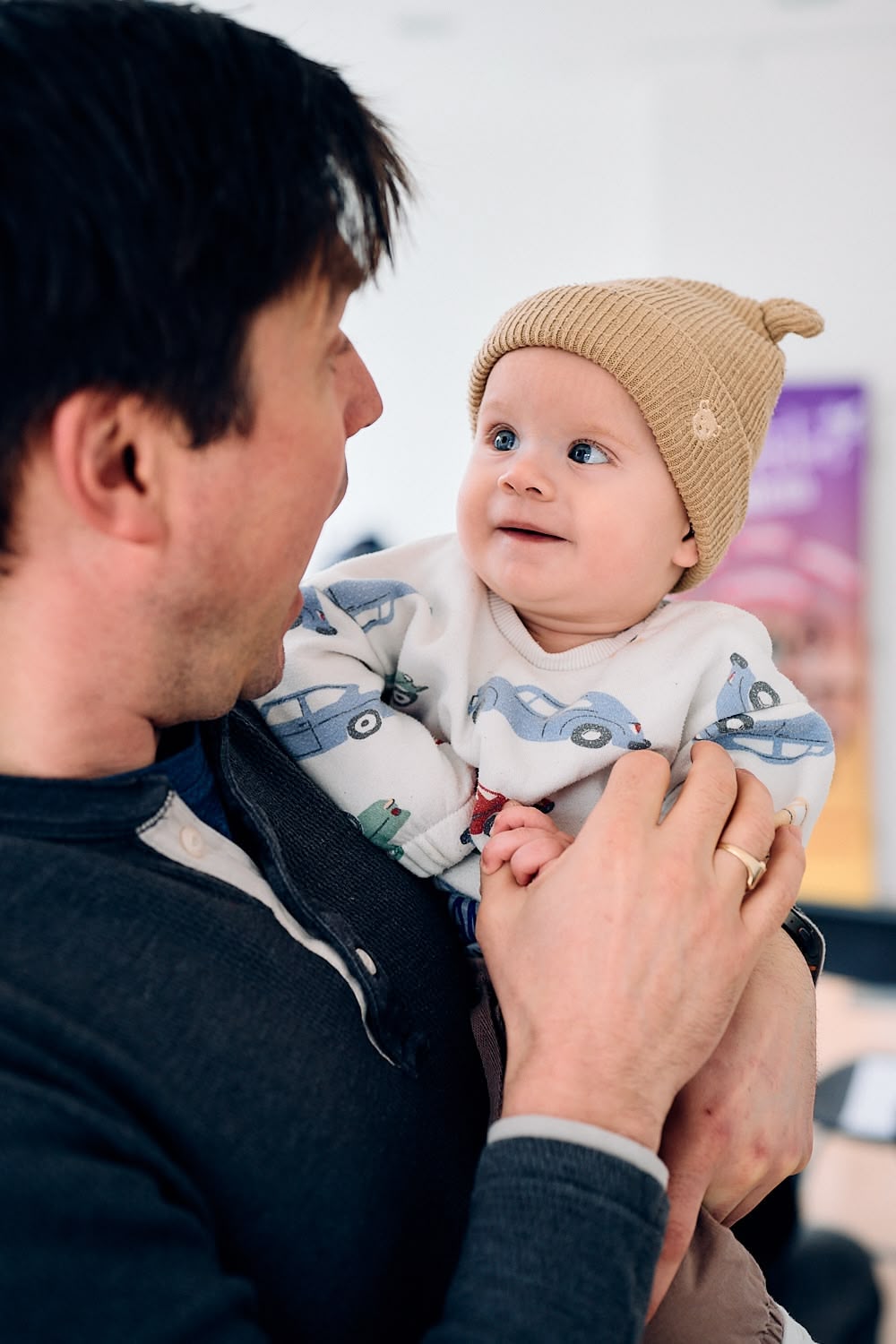 Baby and man at an event